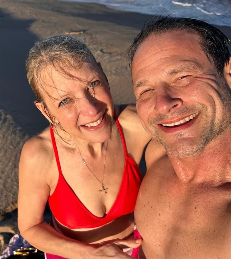 Bethany and Jeff smiling on the beach